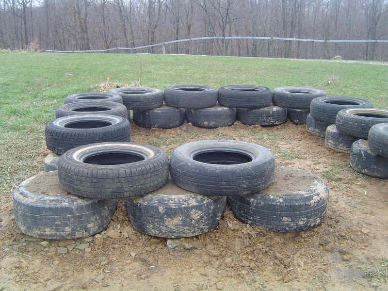 Tire foundation for plastic bottle greenhouse